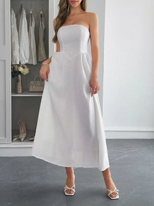 Detailed close-up of a white strapless A-line maxi dress in breathable cotton-linen fabric