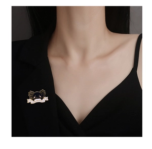 Detail of cute axolotl enamel pin on black blazer with I like you a lot text