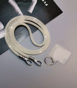Close-up of a white mesh rhinestone phone lanyard with silver metal clip and connector