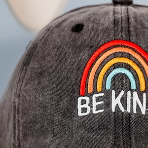 Vintage dark grey washed cotton baseball cap with rainbow BE KIND embroidery detail