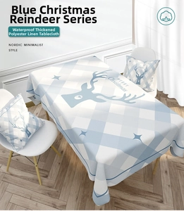 Close-up of waterproof linen-blend tablecloth with blue deer pattern and matching pillows