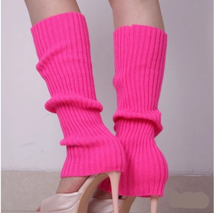 Detail of neon pink ribbed knit leg warmers showing stretch texture and stylish fit