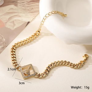 Detail view of gold-plated bracelet with cubic zirconia pendant and size measurements