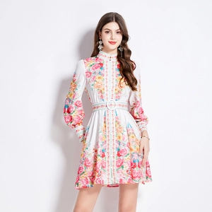 Floral print vintage dress with stand collar and lantern sleeves on a white background