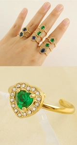 Macro shot of 18K gold plated double layer rings with colorful zircon heart and gems