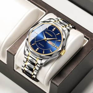 Detail of quartz watch with blue dial and diamond markers in a premium display box