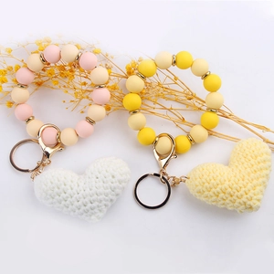 Silicone bead heart keychain wristlet in pink and yellow with crochet heart charms