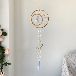 Detail of crescent moon suncatcher with pink crystals and multi-faceted glass prism