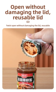 Macro shot of stainless steel jar opener twisting off a glass bottle lid effortlessly