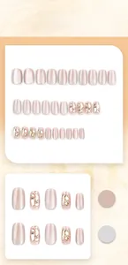 Detailed view of pink cat-eye press-on nails with glitter and rhinestone accents