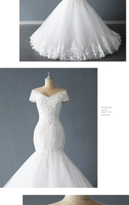 Détail de robe de mariée en dentelle à épaules dénudées avec perles et coupe sirène