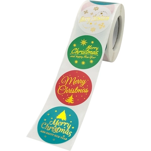 Roll of 1.5-inch gold foil Christmas stickers with festive tree and snowflake patterns