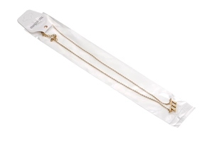 Detailed view of gold stainless steel 777 angel number necklace in its packaging