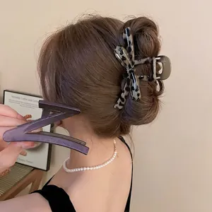 Tortoise shell leopard print bow hair claw clip and purple resin shark clip for women