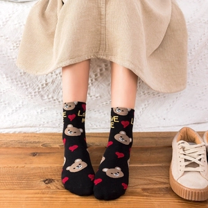 Women's cotton crew socks with brown bear and heart pattern featuring LOVE ME text