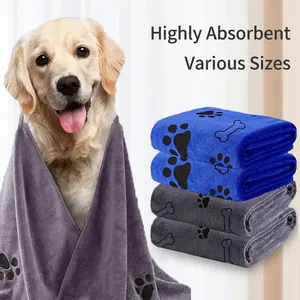 Absorbent microfiber pet towels in blue, purple and grey with paw prints and bone patterns