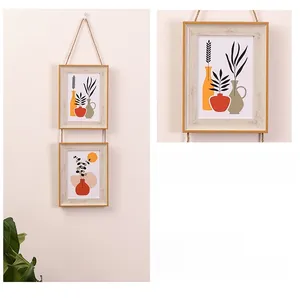 Hanging wooden photo frame set with natural jute rope and botanical art prints