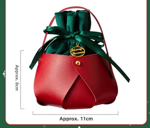 Detail of red leather Christmas gift bag with green velvet drawstring and size dimensions