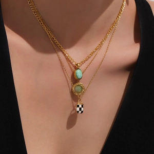 Three-layer gold stainless steel necklace with turquoise pendant and checkered enamel detail
