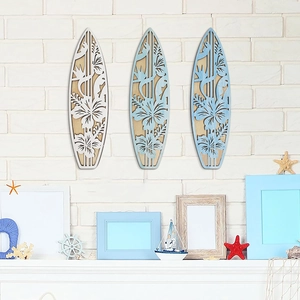 Three-piece wooden surfboard wall art set with cutout hibiscus flowers for beach decor