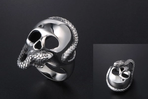 Detailed close-up of gothic silver skull ring with snakes made of durable titanium steel