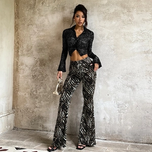 Women's black lace crop top with high-waisted zebra print flare pants two-piece set