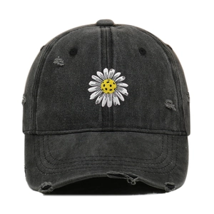 Vintage black distressed washed denim baseball cap featuring daisy soccer embroidery