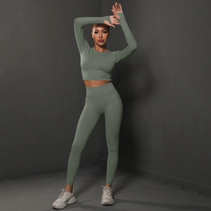 Detail of high-waist seamless sage green yoga set showing thumb holes and elastic fabric