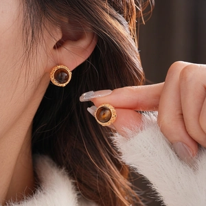 Vintage gold-rimmed zircon and tiger eye stone stud earrings for women with elegant finish