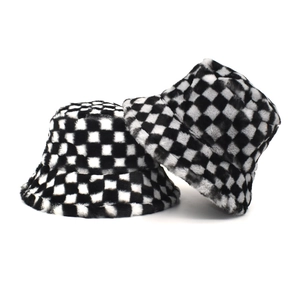 Close-up of black and white checkerboard plush bucket hat with soft faux fur texture