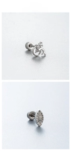 Detail of dolphin and textured oval stud earrings with zircon in titanium steel