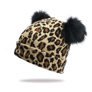 Knitted leopard print beanie with double faux fur pom-poms and thick cuffed edge for women