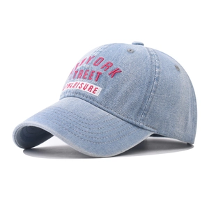Faded light blue denim baseball cap featuring pink New York Street embroidery