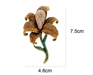 Detailed view of lily flower brooch with orange and pink rhinestones, 7.5cm x 4.6cm size