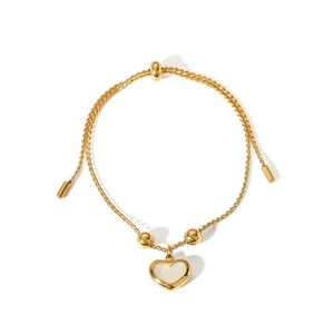 Adjustable golden bracelet featuring a white shell heart pendant and round bead details