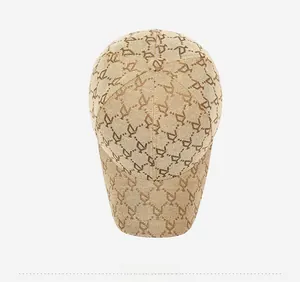 Top-down view of a khaki baseball cap featuring vintage jacquard letter patterns