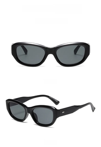 Front and side views of vintage cat-eye sunglasses with wide legs and glossy black finish