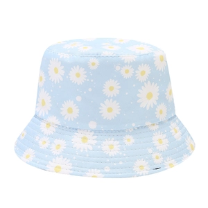 Light blue bucket hat with daisy print featuring wide brim for summer sun protection