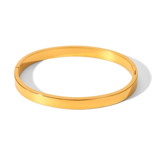 Detailed close-up of a polished gold-plated stainless steel open heart bangle bracelet