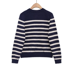 Classic crew neck striped knit sweater in navy and beige stripes on a wooden hanger