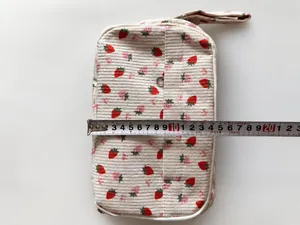 Detail view of 20.5cm strawberry print corduroy pencil case with measuring tape