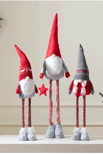 Detail of Christmas gnomes with knitted hats and long striped legs for holiday decor