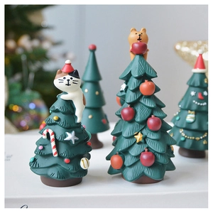 Miniature resin Christmas trees featuring cute cat and bear toppers with candy ornaments