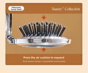 Detail of silver foldable hair brush with retractable bristles and press-to-expand air cushion