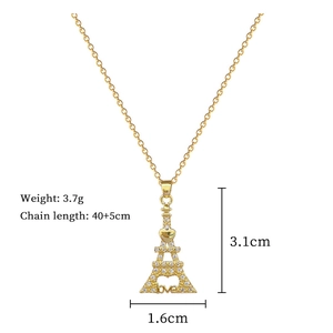 Detailed view of gold Eiffel Tower necklace with white rhinestones and love charm dimensions