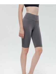 Detail view of high-waisted dark grey yoga shorts showcasing seamless elastic fit