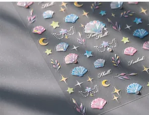 Detail of 3D embossed shell and starfish nail stickers with iridescent pearl finish