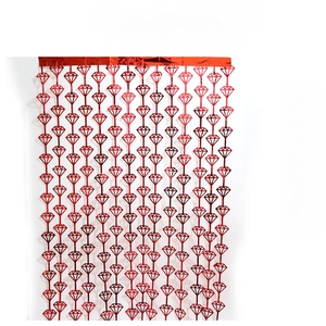 Detail of red diamond-shaped PET tinsel fringe curtain for festive party decorations