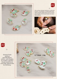 Detailed view of 3D resin cherry pendants with green leaves and gold metal hanging loops