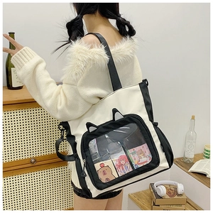 Canvas tote bag with cute cat ears and transparent front pocket for daily commute and school.